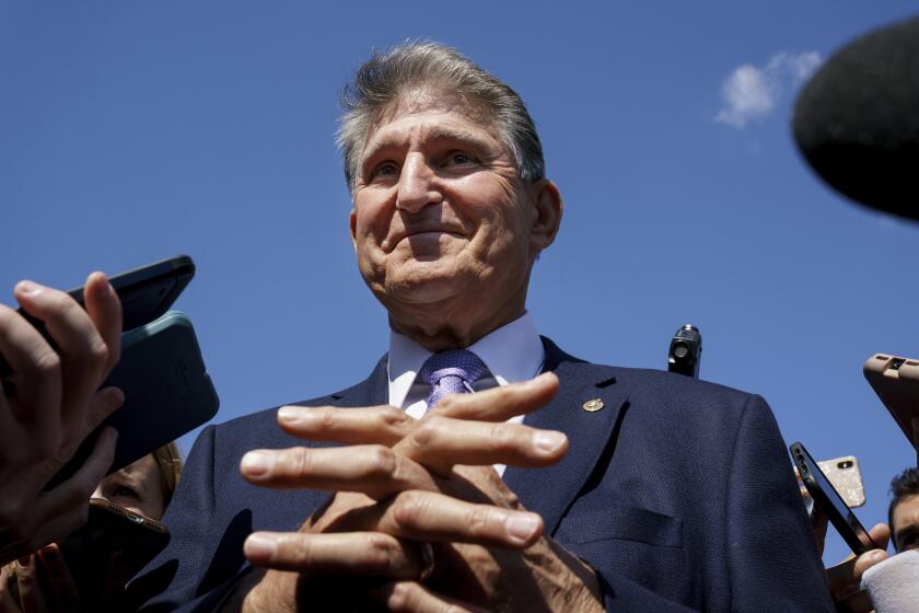 Sen. Joe Manchin, D-W.Va., a centrist Democrat vital to the fate of President Joe Biden's $3.5 government overhaul, updates reporters about his position on the bill, at the Capitol in Washington, Thursday, Sept. 30, 2021. Despite months of being courted and cajoled, Sen. Joe Manchin is still not a yes on President Joe Biden's big $2 trillion domestic package and has thrown Democrats into turmoil. (AP Photo/J. Scott Applewhite, File)
