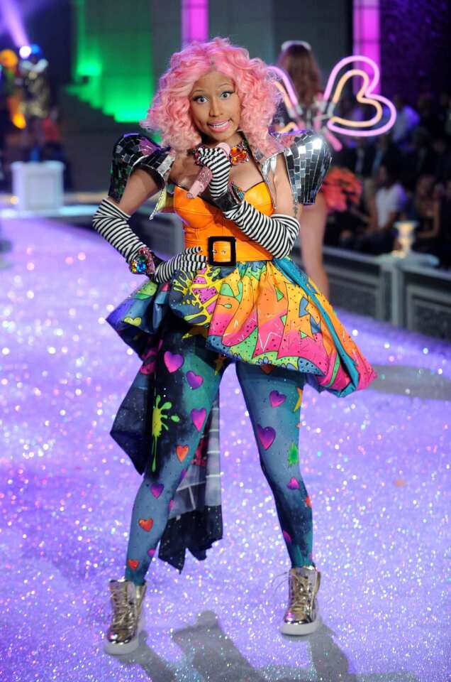 Minaj performed at the fashion show in a mix-and-match outfit of rainbow colors, zebra print and metallic sparkle.