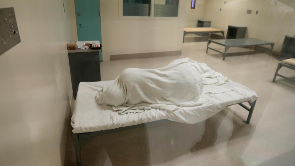 An inmate sleeps on the fourth floor of Twin Towers Correctional Facility, which is reserved for those with the highest medical and psychiatric needs.
