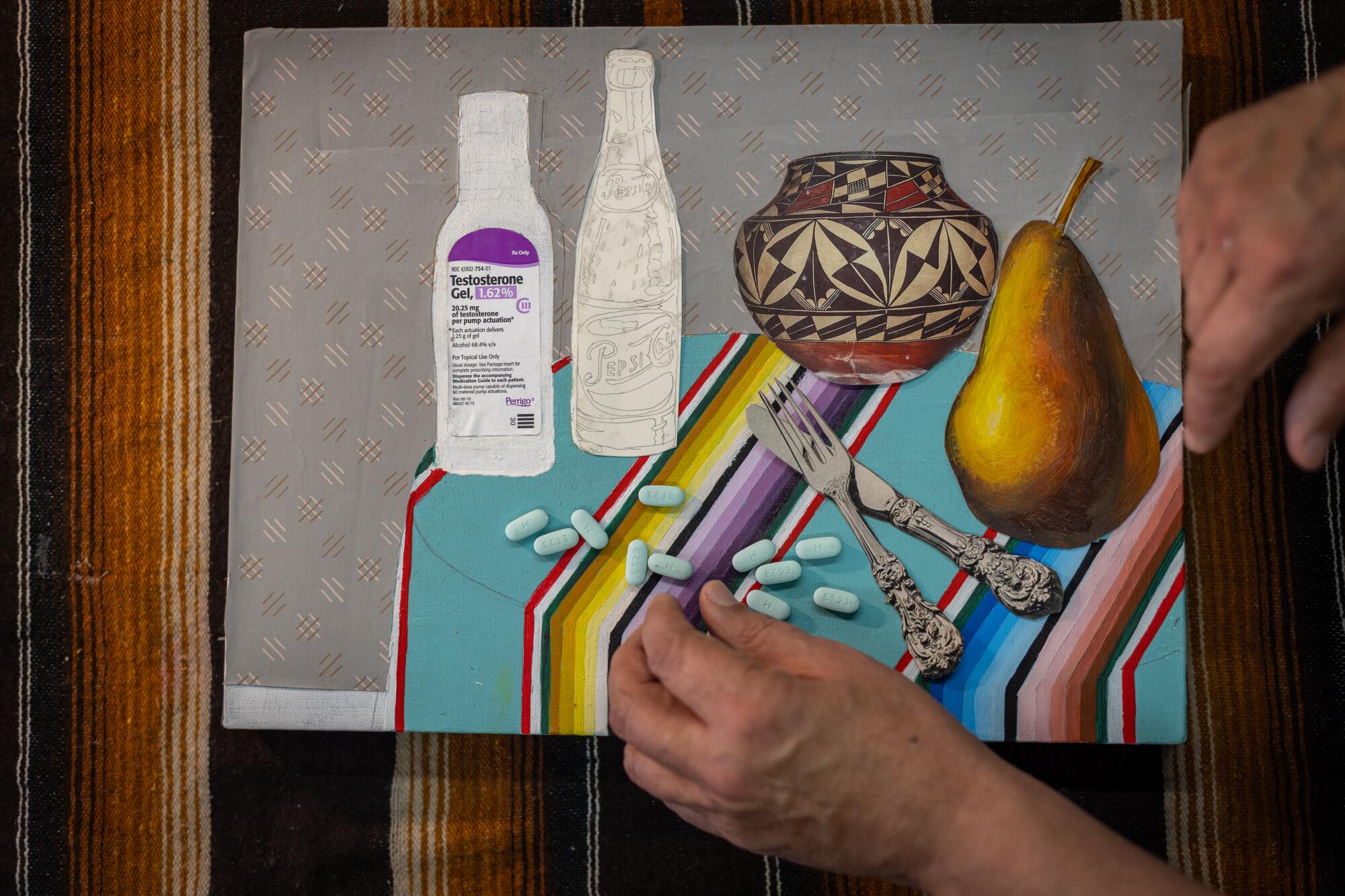 A hand arranges pills on a canvas that shows a table covered in a bright serape and drawings of HIV medication bottles.