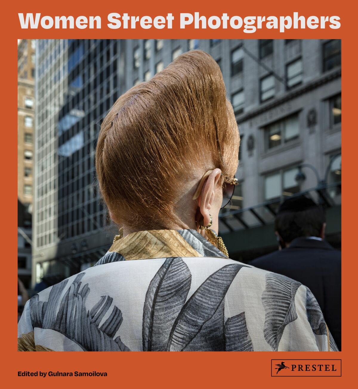 This cover image released by Prestel shows "Women Street Photographers," a collection of photos edited by Gulnara Samoilova. (Prestel via AP)