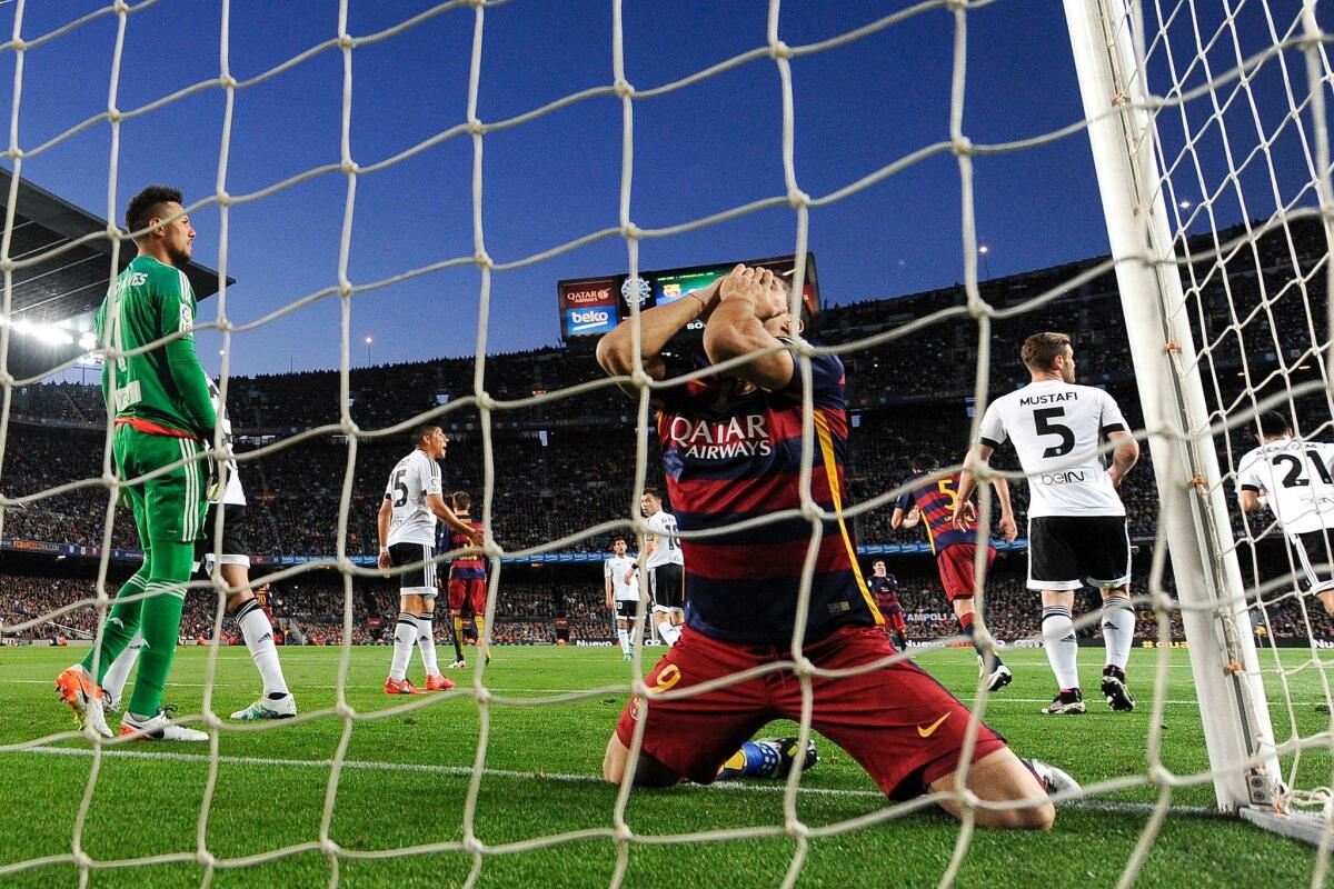 Barcelona's Uruguayan forward Luis Suarez kneels in the goal during the Spanish league football match FC Barcelona vs Valencia CF at the Camp Nou stadium in Barcelona on April 17, 2016. / AFP PHOTO / JOSEP LAGOJOSEP LAGO/AFP/Getty Images ** OUTS - ELSENT, FPG, CM - OUTS * NM, PH, VA if sourced by CT, LA or MoD **