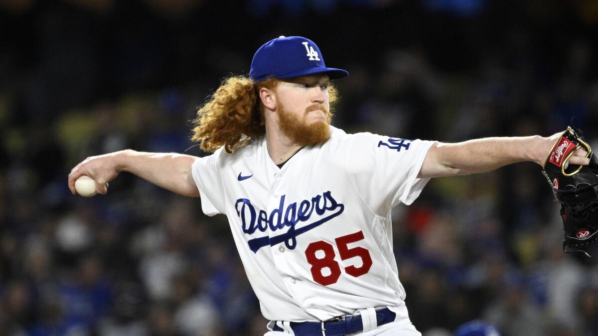 Los Angeles Dodgers starting pitcher Dustin May throws to the plate during the seventh inning.