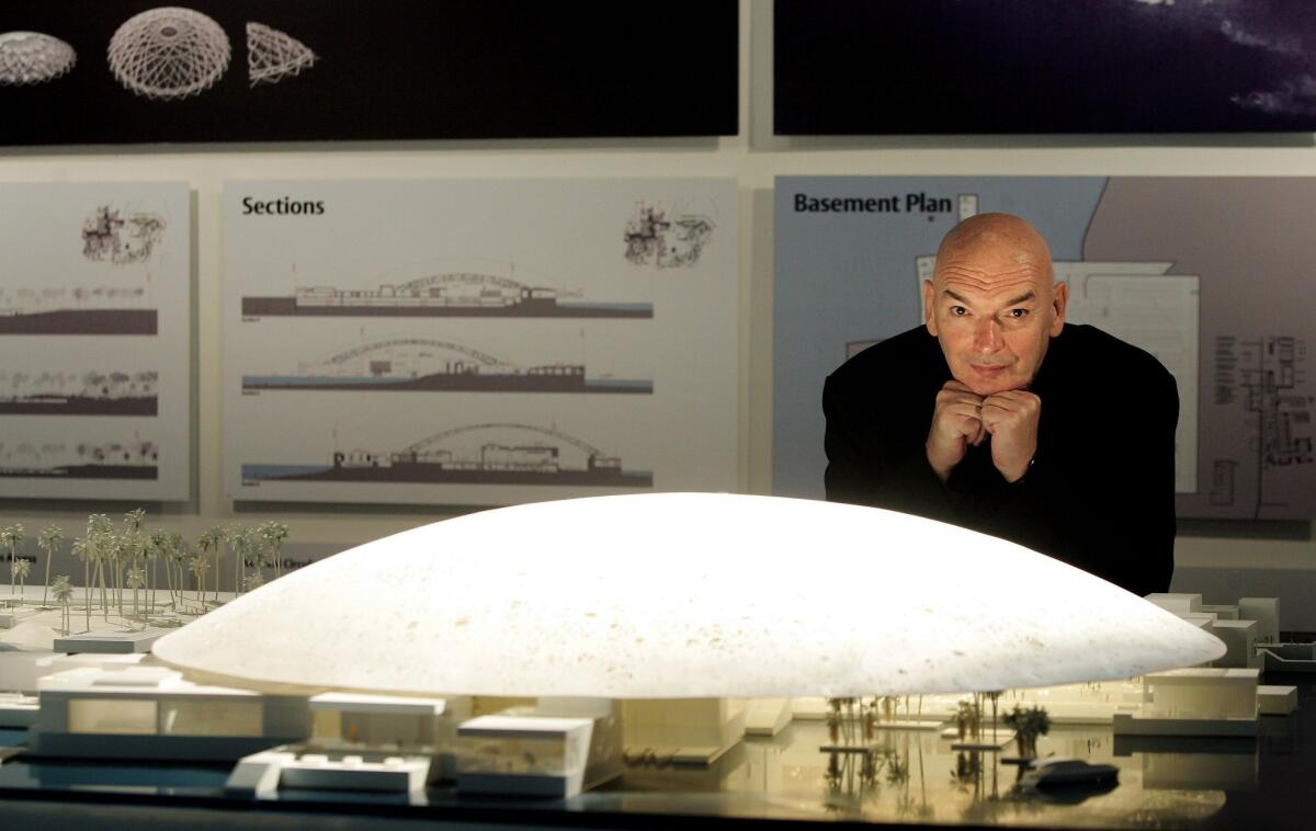 French architect Jean Nouvel in front of a model of the Louvre Abu Dhabi, expected to open in 2015.