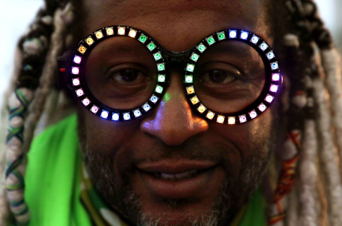 Marcus Gladney, founder of the Venice Electric Light Parade, wears eyeglasses decked with lights.