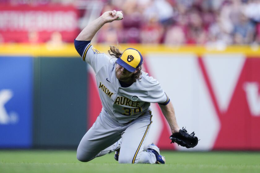 Milwaukee Brewers starting pitcher Corbin Burnes reacts after catching a fly ball hit by Cincinnati Reds' Stuart Fairchild to end the sixth inning of a baseball game in Cincinnati, Friday, June 2, 2023. (AP Photo/Jeff Dean)