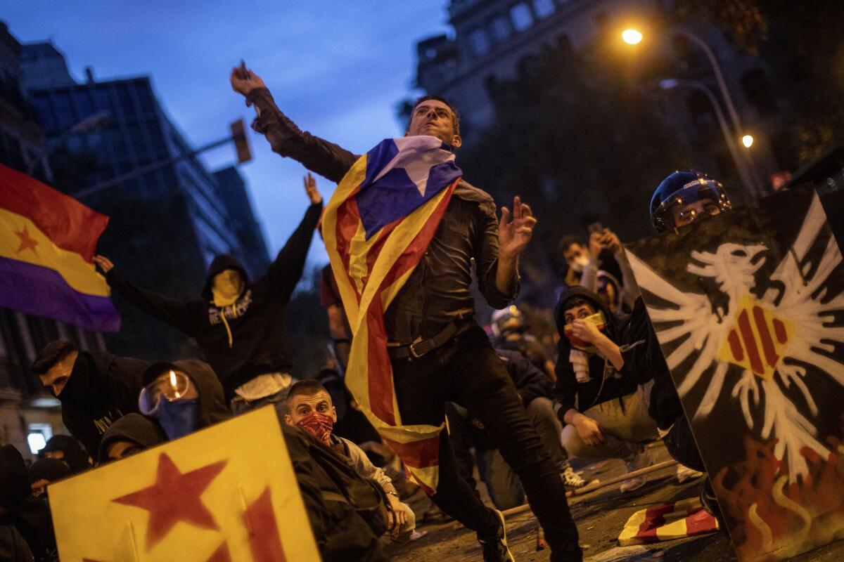 Catalan pro-independence protester throwing a stone