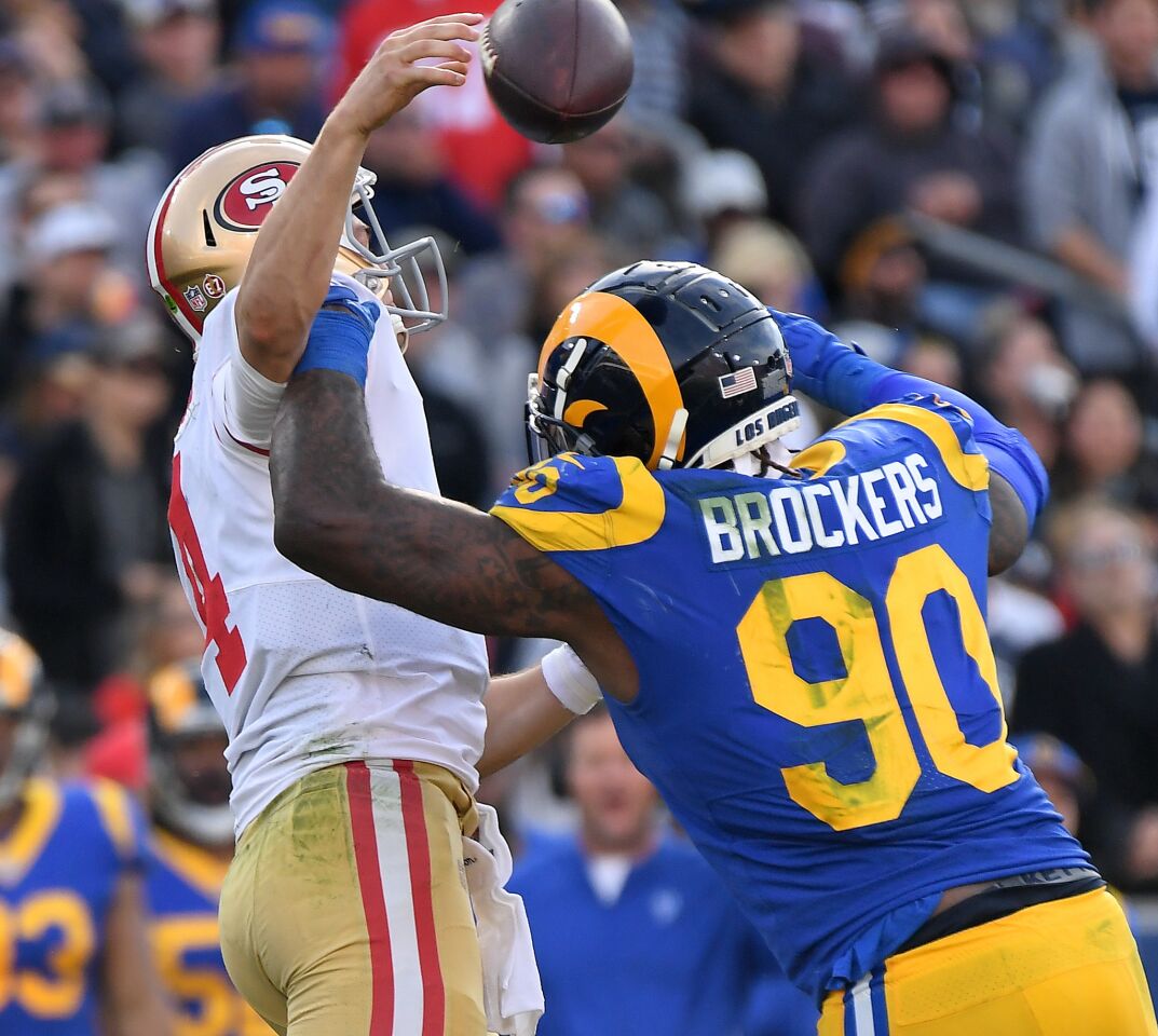 Rams defensive lineman Michael Brockers forces 49ers quarterback Nick Mullens into an incompletion.