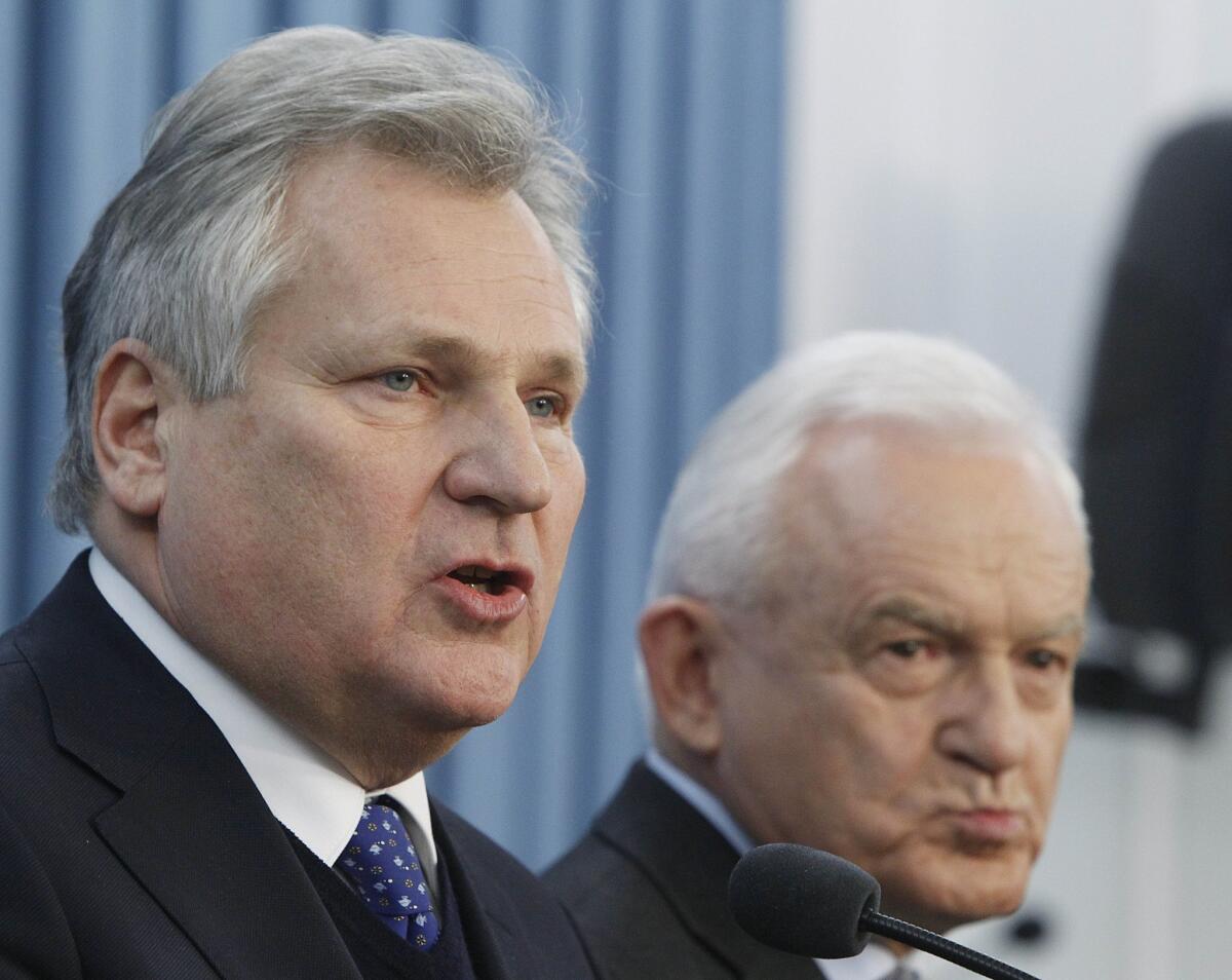 Former Polish President Aleksander Kwasniewski, left, and former Prime Minister Leszek Miller, at a Warsaw press conference Dec. 10 where they confirmed Poland had collaborated in the CIA interrogation of terror suspects after Sept. 11, 2001.