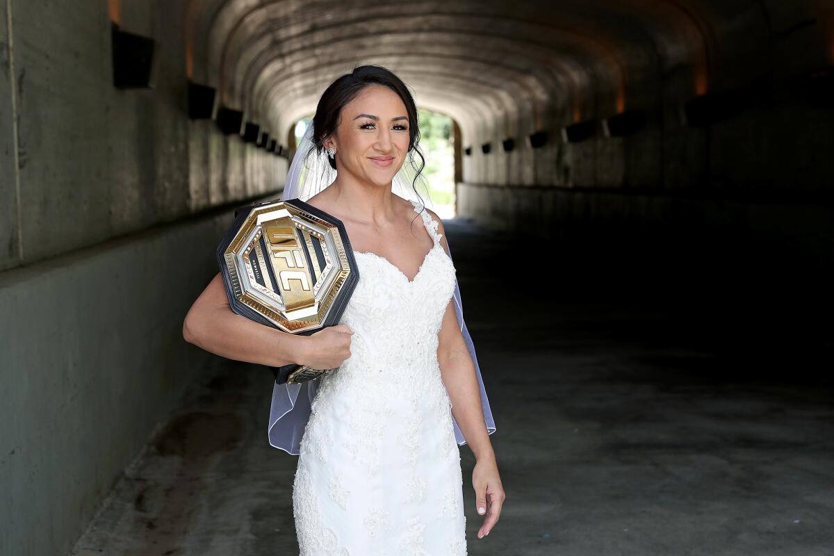 UFC women's strawweight champion Carla Esparza, 34, wears her wedding dress at Jeffrey Open Space Trail on May 11.