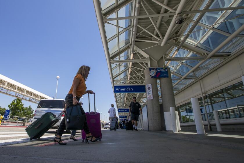 ONTARIO, CALIF. -- MONDAY, AUGUST 12, 2019: Travelers arrive and depart Ontario International Airport in Ontario Monday, Aug. 12, 2019. Uber said it will stop its service at Southern California?s Ontario International Airport because of fee increases. The airport said Lyft will stay. (Allen J. Schaben / Los Angeles Times)