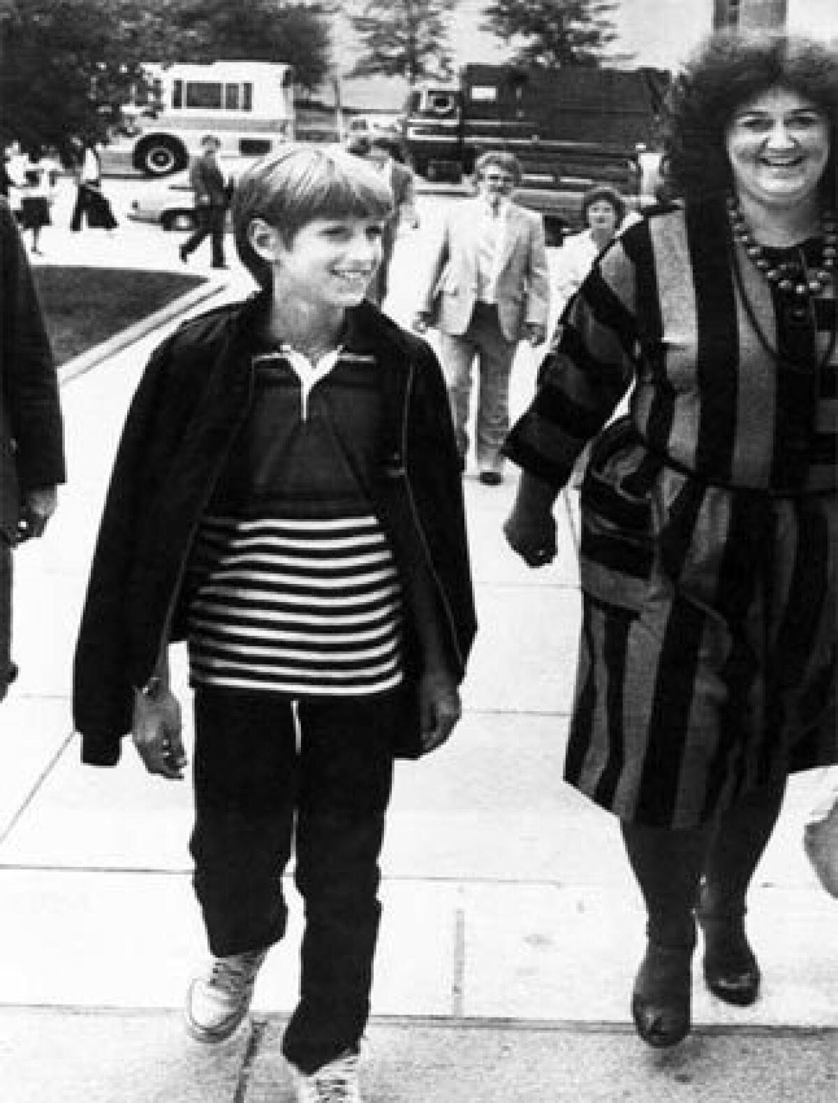 Jeanne White-Ginder, right, shown with son Ryan White in 1985 after he was diagnosed with AIDS, said she is alarmed by Mike Huckabees statements about AIDS. Ryan died in 1990 at age 18.