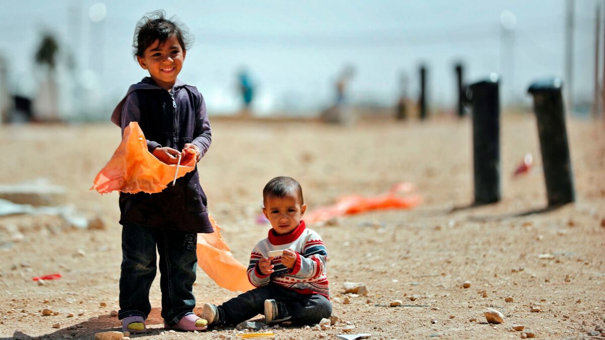 Syrian refugees at the Zaatari camp, which shelters about 80,000 Syrians on the Jordanian border with war-ravaged Syria.