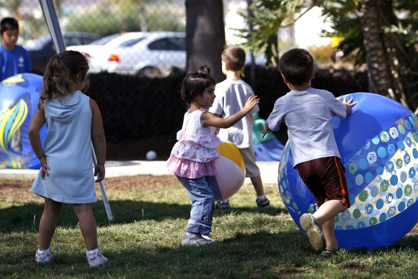 s.daycare.2.072607.db.jpg/ Photo by Don Boomer/ Several preschoolers play with a variety of beach ball at the CSUSM off-campus child care center on Thursday. There will be high fees at the new on-campus child care center slated to open Sept. 4.