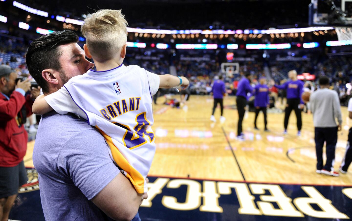 Jonathan Aldy takes his son, 4-year-old Abel, to his first NBA game as the Lakers take the court for Kobe Bryant's final game in New Orleans.