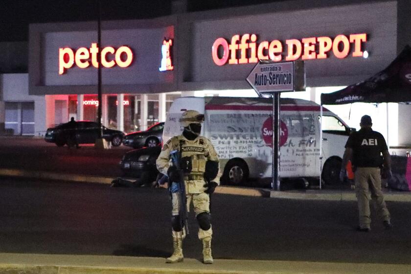 Members of the Mexican Army and forensic experts work at the site where four radio station workers were killed and two restaurant employees were wounded in Ciudad Juarez, state of Chihuahua, Mexico, on August 11, 2022. (Photo by HERIKA MARTINEZ / AFP) (Photo by HERIKA MARTINEZ/AFP via Getty Images)