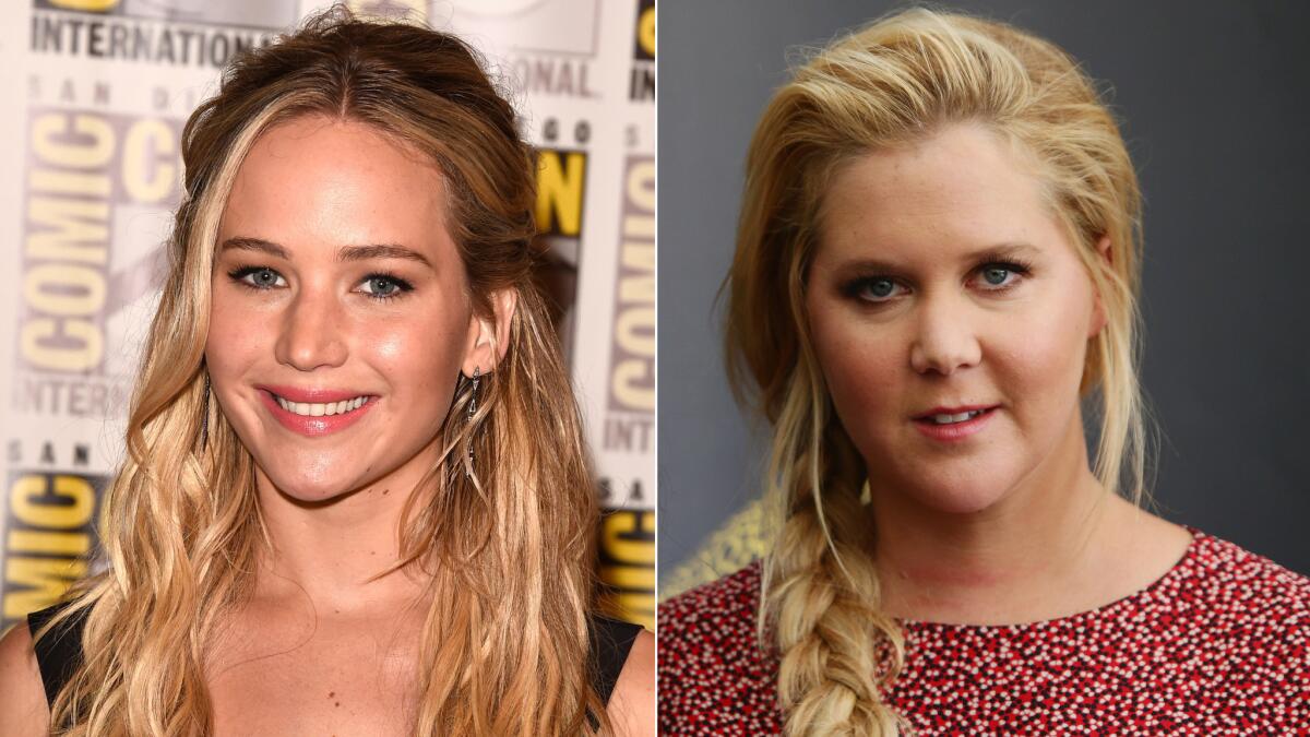 Actresses Jennifer Lawrence, left, and Amy Schumer are working on a screenplay together.