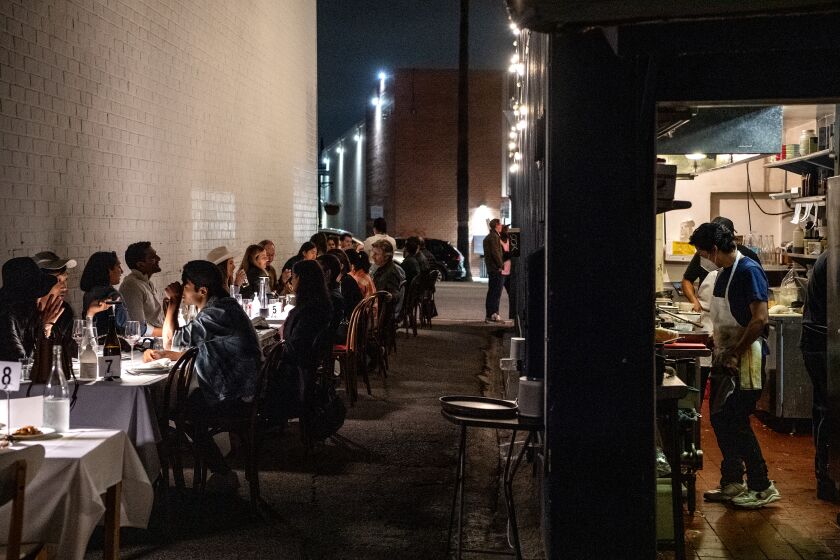 SHERMAN OAKS, CA - OCTOBER 07: Customers fill the alleyway tables for the A la carte menu from chef /owner Justin Pichetrungsi at Anajak Thai on Thursday, Oct. 7, 2021 in Sherman Oaks, CA. (Mariah Tauger / Los Angeles Times)