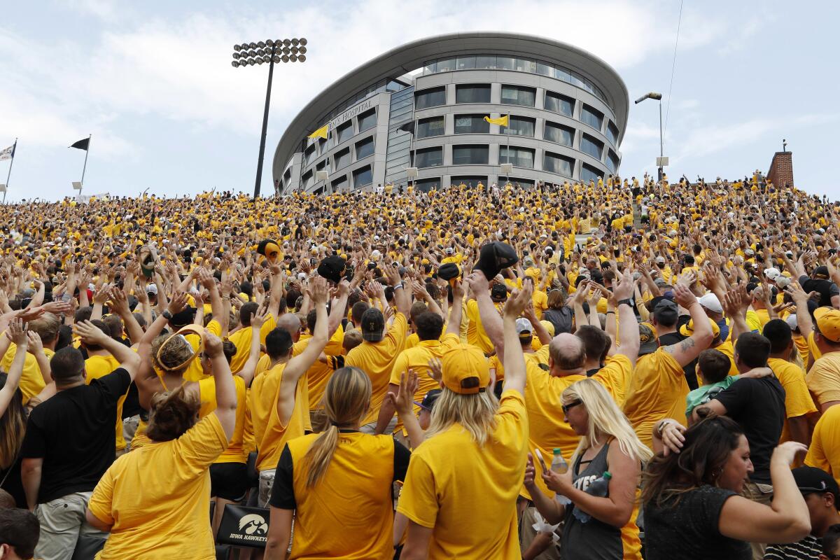 Fans at Kinnick Stadium wave toward Stead Family Children's Hospital on Sept. 16, 2017.