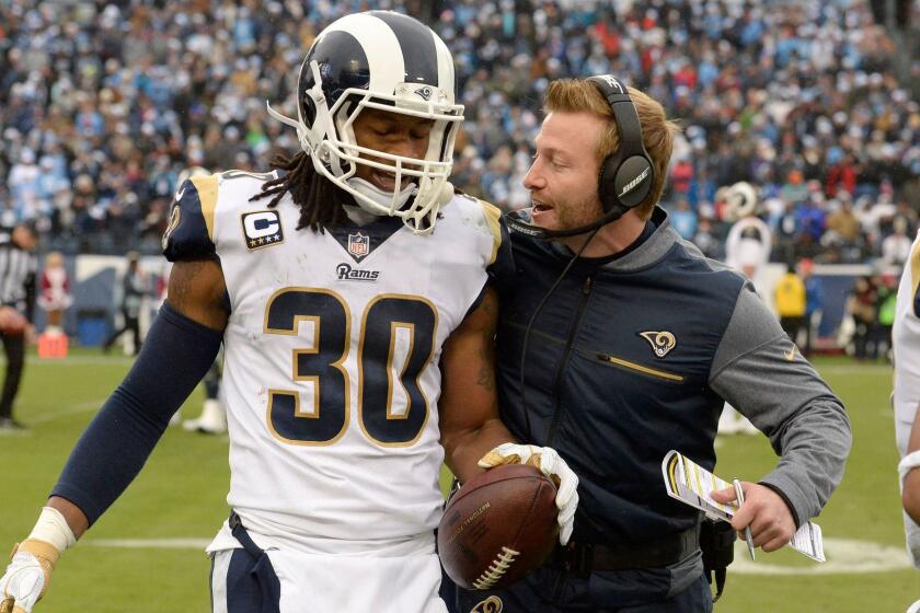 Los Angeles Rams running back Todd Gurley (30) is congratulated by head coach Sean McVay after Gurley scored a touchdown against the Tennessee Titans on an 80-yard pass reception in the first half of an NFL football game Sunday, Dec. 24, 2017, in Nashville, Tenn. (AP Photo/Mark Zaleski)