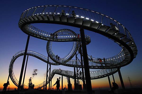 "Tiger and Turtle" rises 68 feet high. Its base is 158 by 113 feet. The "track" stretches 722 feet and is about three feet wide.