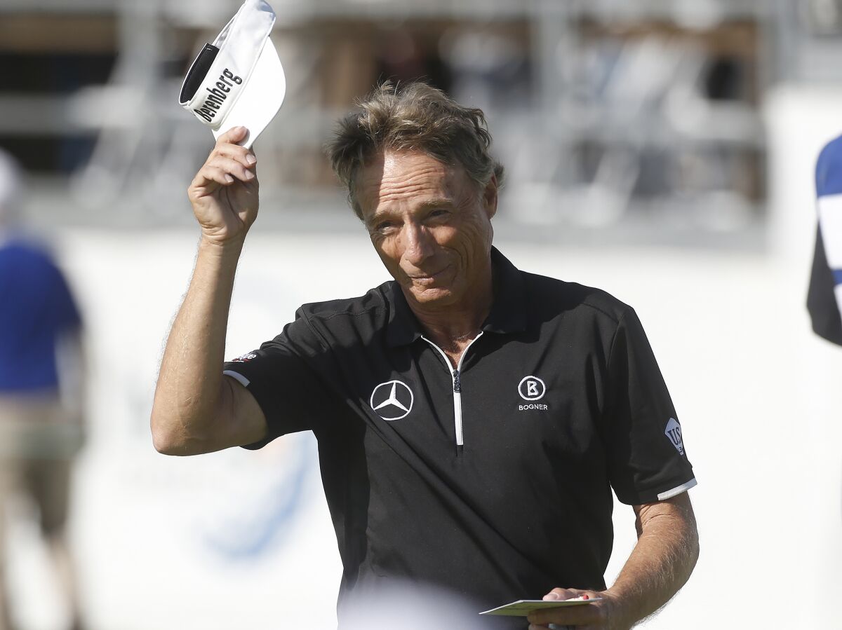 Bernhard Langer tips his hat to the gallery after finishing his round on the 18th hole during the Hoag Classic on Friday.