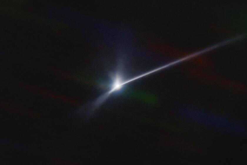 This image made available by NOIRLab shows a plume of dust and debris blasted from the surface of the asteroid Dimorphos by NASA's DART spacecraft after it impacted on Sept. 26, 2022, captured by the U.S. National Science Foundation's NOIRLab's SOAR telescope in Chile. The expanding, comet-like tail is more than 6,000 miles (10,000 kilometers) long. (Teddy Kareta, Matthew Knight/NOIRLab via AP)