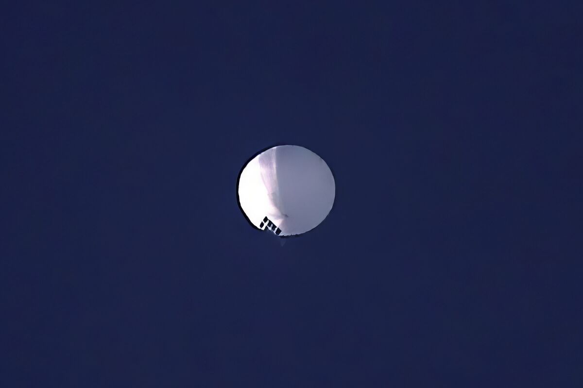 A high-altitude balloon floats in the sky