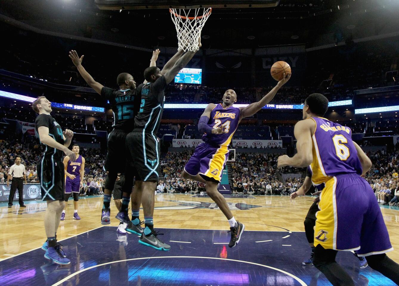 Lakers forward Kobe Bryant drives to the basket against the Charlotte Hornets.