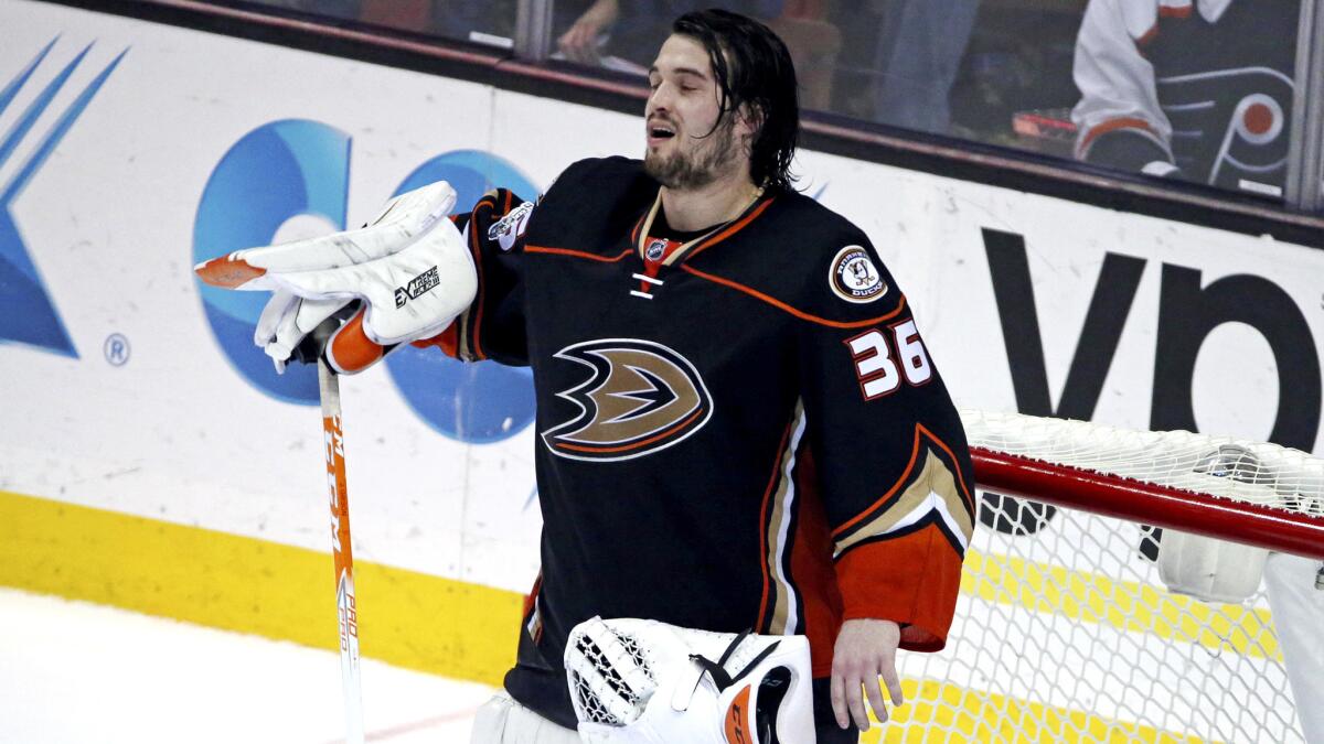Ducks goalie John Gibson (36) returns to the net after a timeout late in the game against the Flyers.