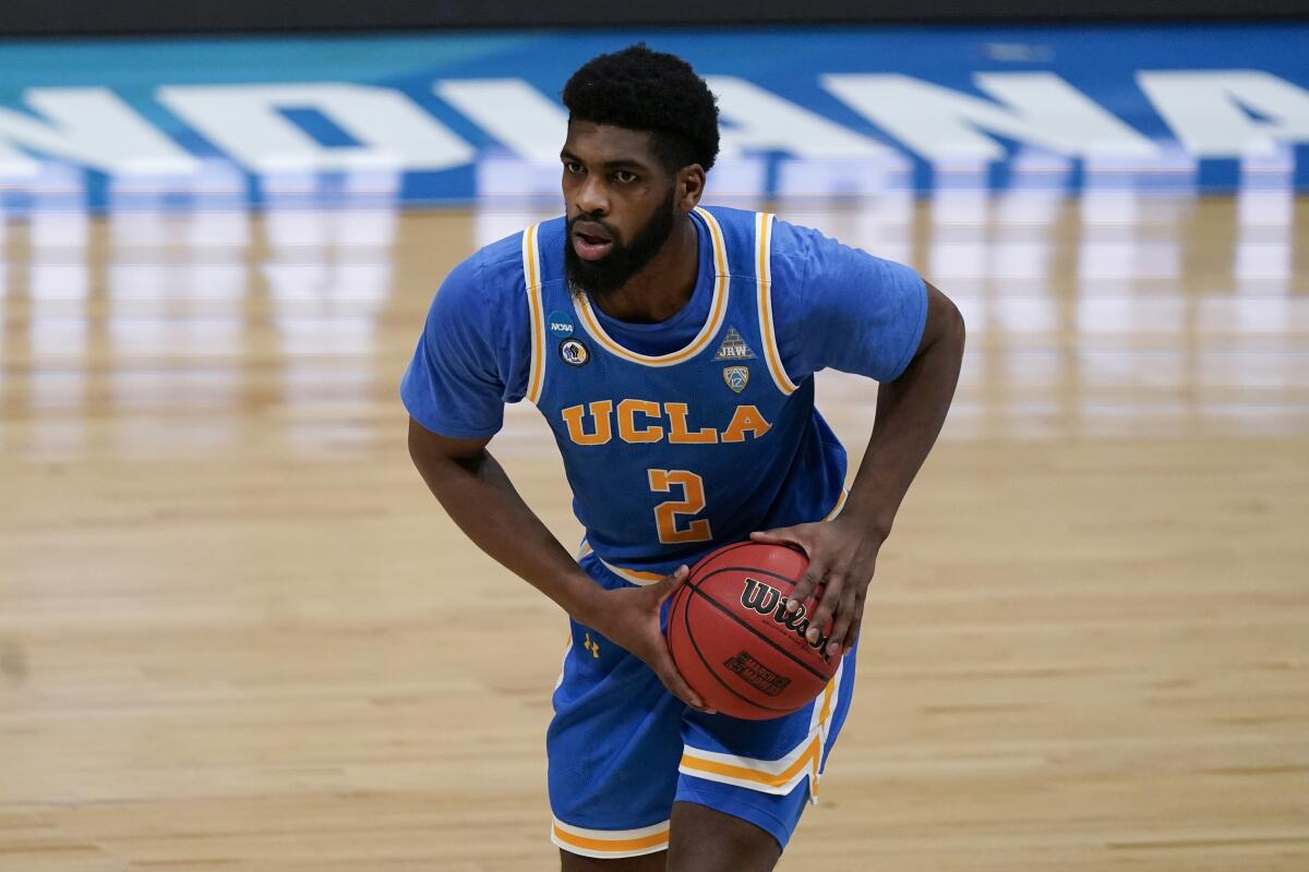 UCLA forward Cody Riley looks to pass against Michigan in the NCAA tournament on March 31.