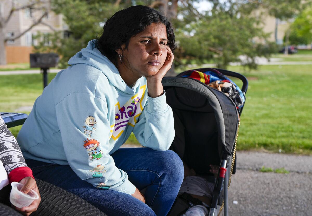 Ivanni Herrera looks on during an interview in a park in Aurora, Colo.