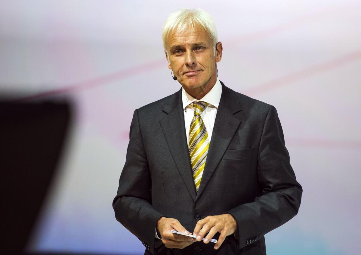 Volkswagen named Matthias Mueller, its Porsche head, as chief executive to replace Martin Winterkorn, who quit amid the German automaker's emissions scandal.