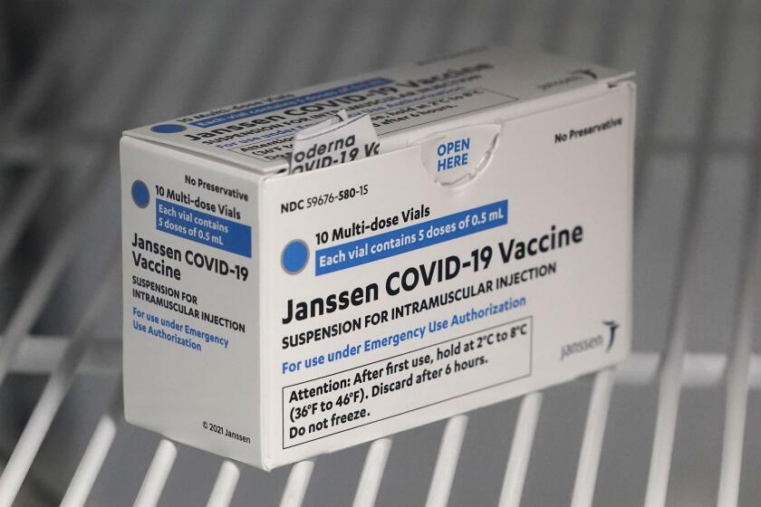 FILE - In this March 25, 2021 file photo, a box of the Johnson & Johnson COVID-19 vaccine is shown in a refrigerator at a clinic in Washington state. A batch of Johnson & Johnson’s COVID-19 vaccine failed quality standards and can’t be used, the drug giant said late Wednesday, March 31, 2021. The drugmaker didn’t say how many doses were lost, and it wasn’t clear how the problem would impact future deliveries. (AP Photo/Ted S. Warren)