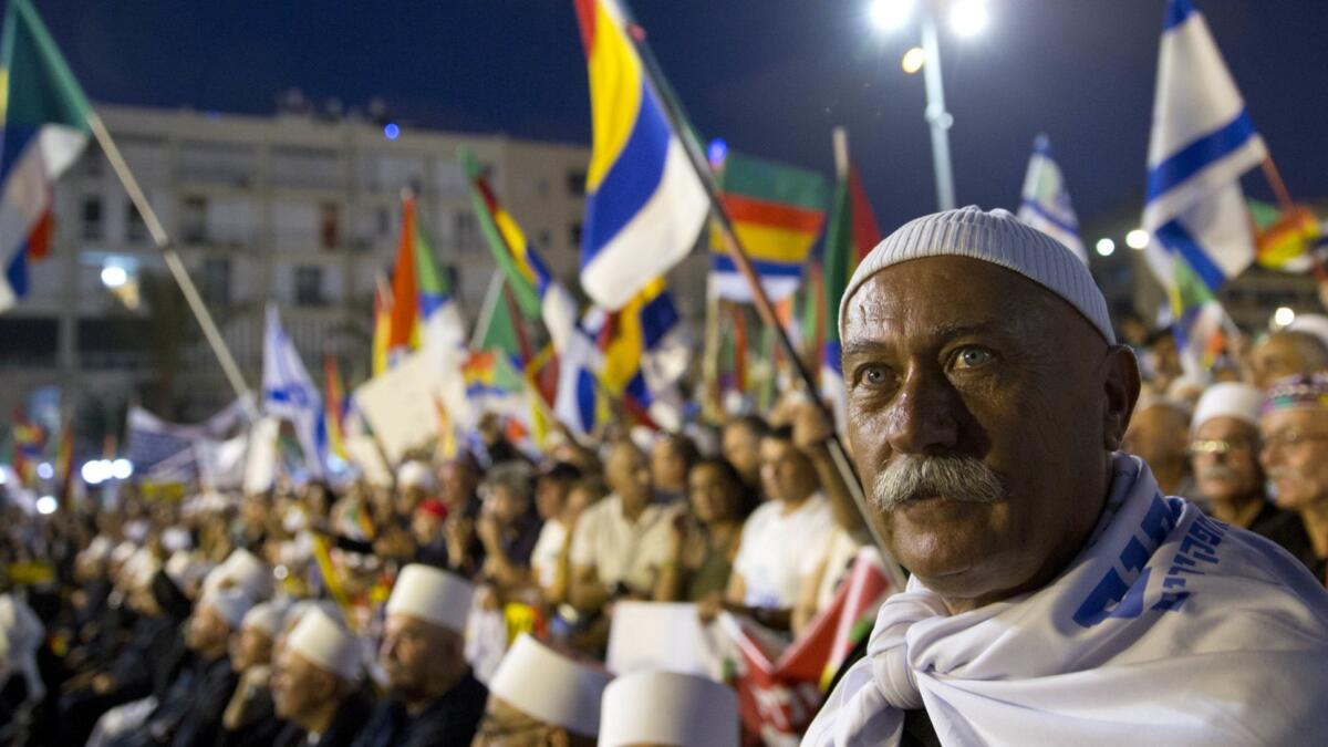 Members of Israel's Druze community participate in a rally against the country's new nation-state law in Tel Aviv on Saturday.