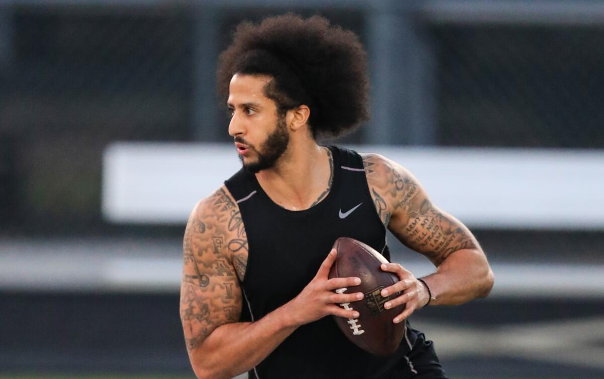 Colin Kaepernick looks to make a pass during a private NFL workout held.