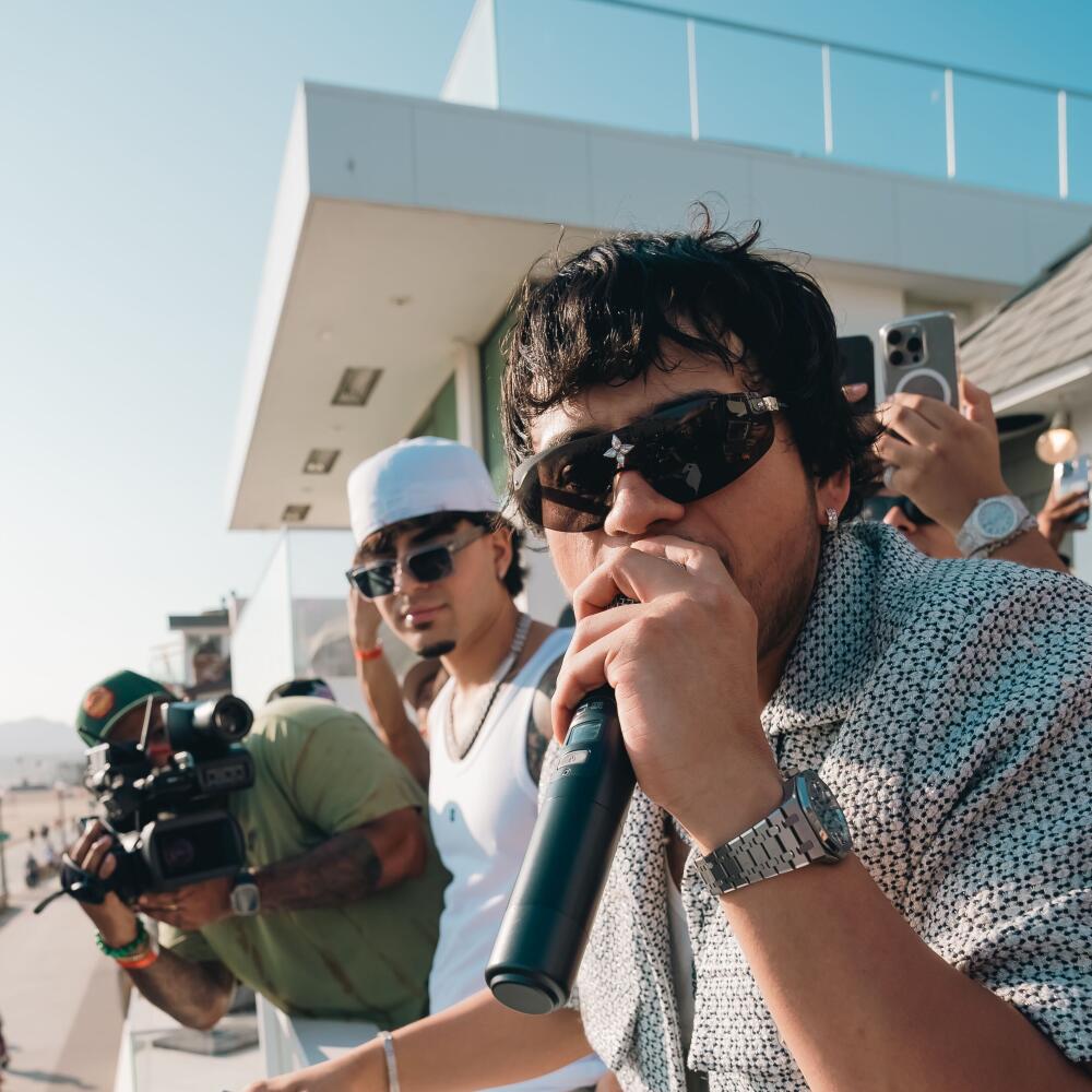 Fuerza Regida frontman Jesús Ortiz Paz performs July 25 during a listening party in Santa Monica.