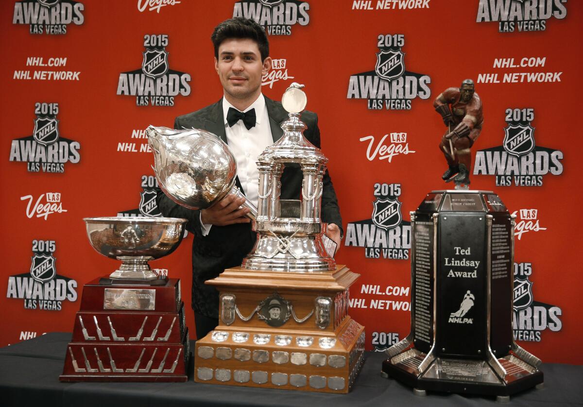 Montreal Candiens goaltender Carey Price poses with the William M. Jennings trophy, the Vezina Trophy, the Ted Lindsay Award trophy and the Art Ross trophy.