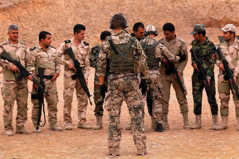 German military trainers instruct Kurdish peshmerga fighters in Irbil, Iraq, on Oct. 2. Kurdish commanders say the training by the U.S. and its allies is moving too slowly.