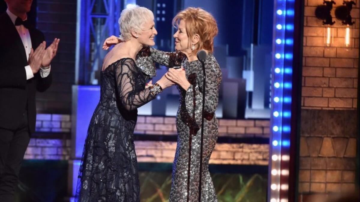 Bette Midler, right, accepts her Tony Award from presenter Glenn Close.