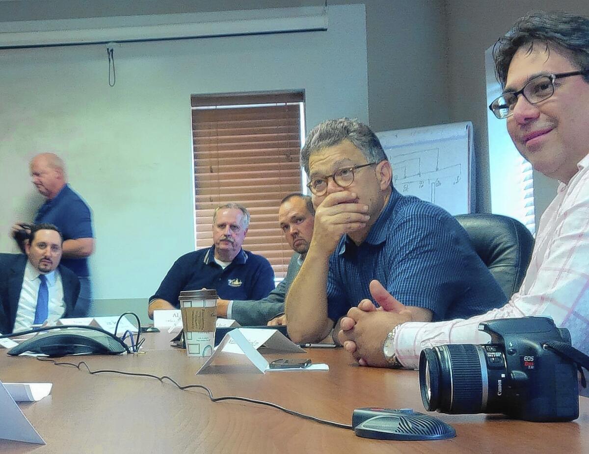 Sen. Al Franken listens during a discussion of worker training programs when he visited manufacturing company Relco in Willmar, Minn., last month.