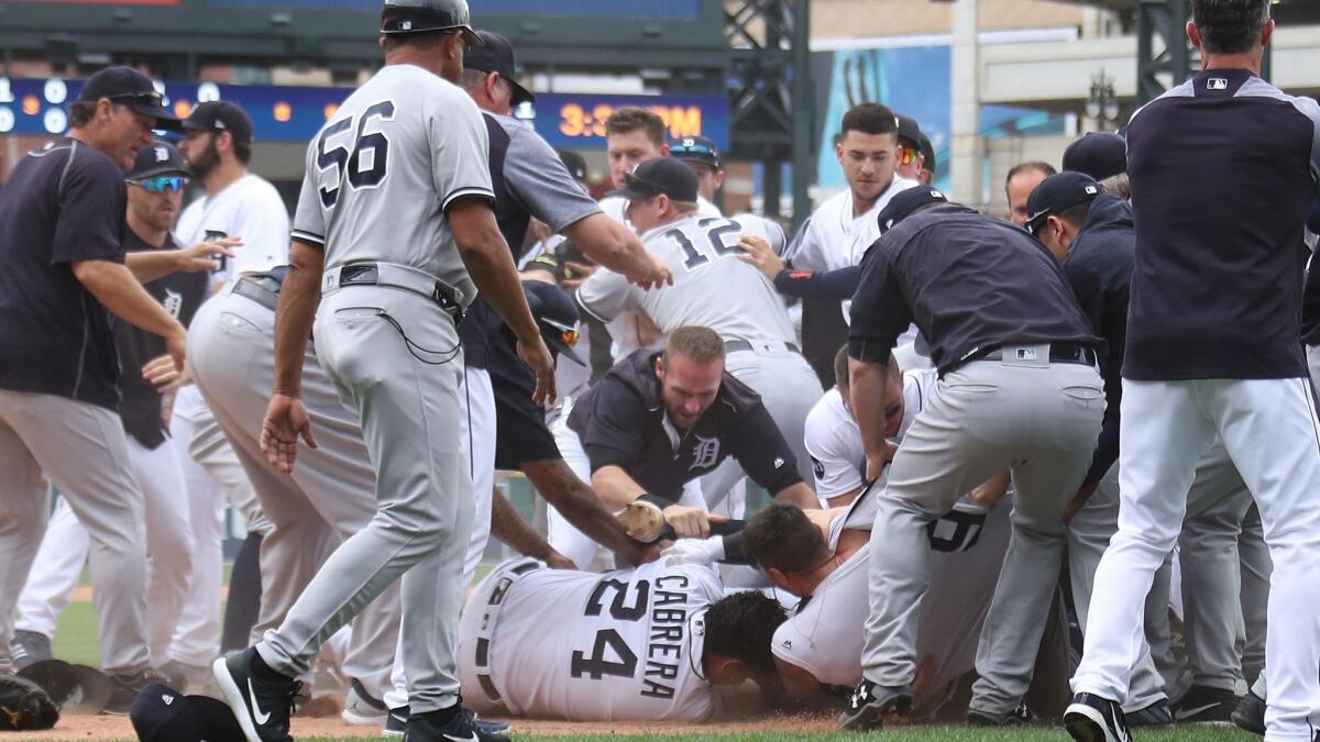 Detroit's Miguel Cabrera is in the middle of the action during a bench-clearing fight between the Tigers and the New York Yankees on Aug. 24.