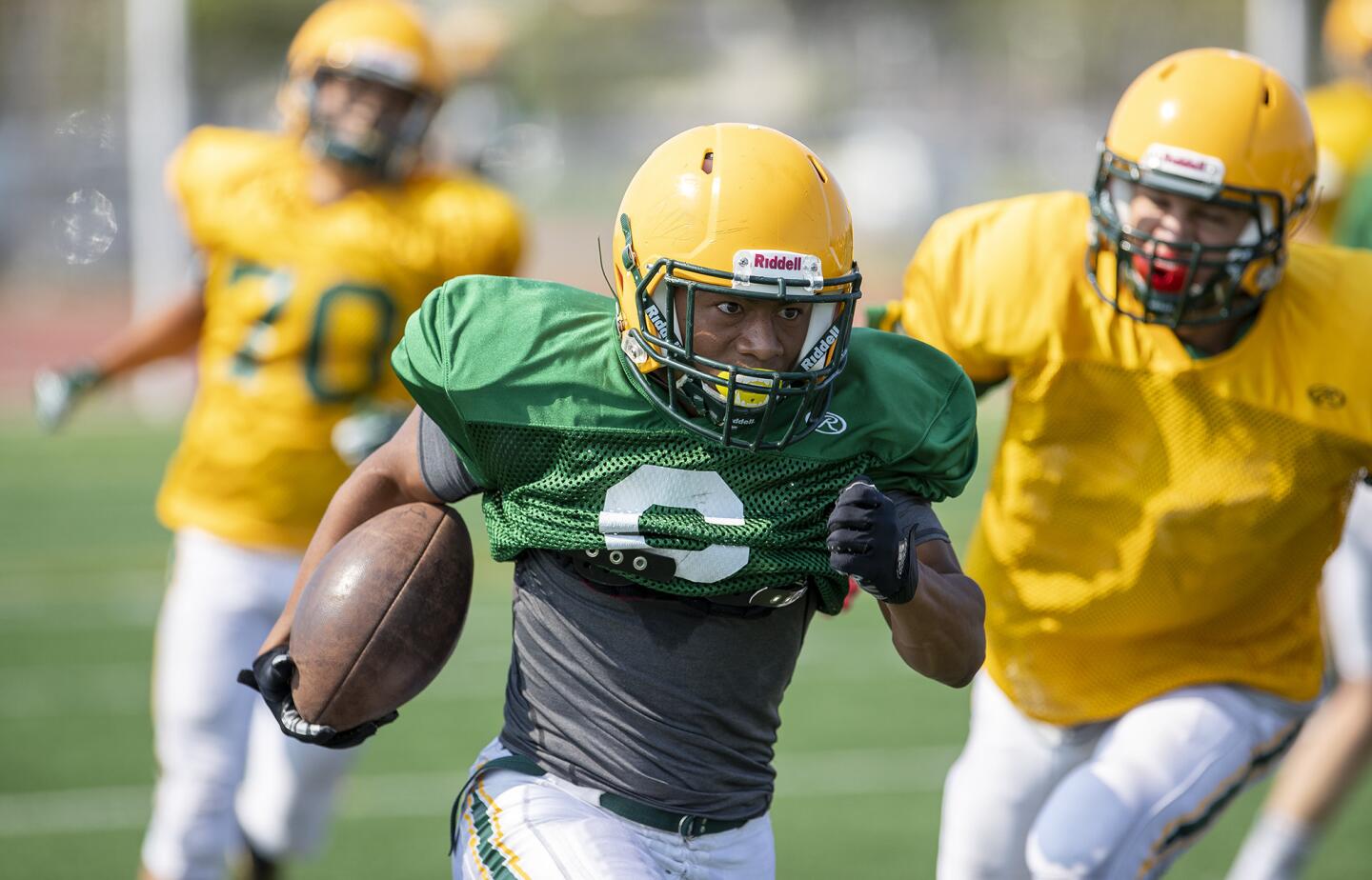 Edison's Isaiah Palmer carries the ball during practice on Saturday, August 11.