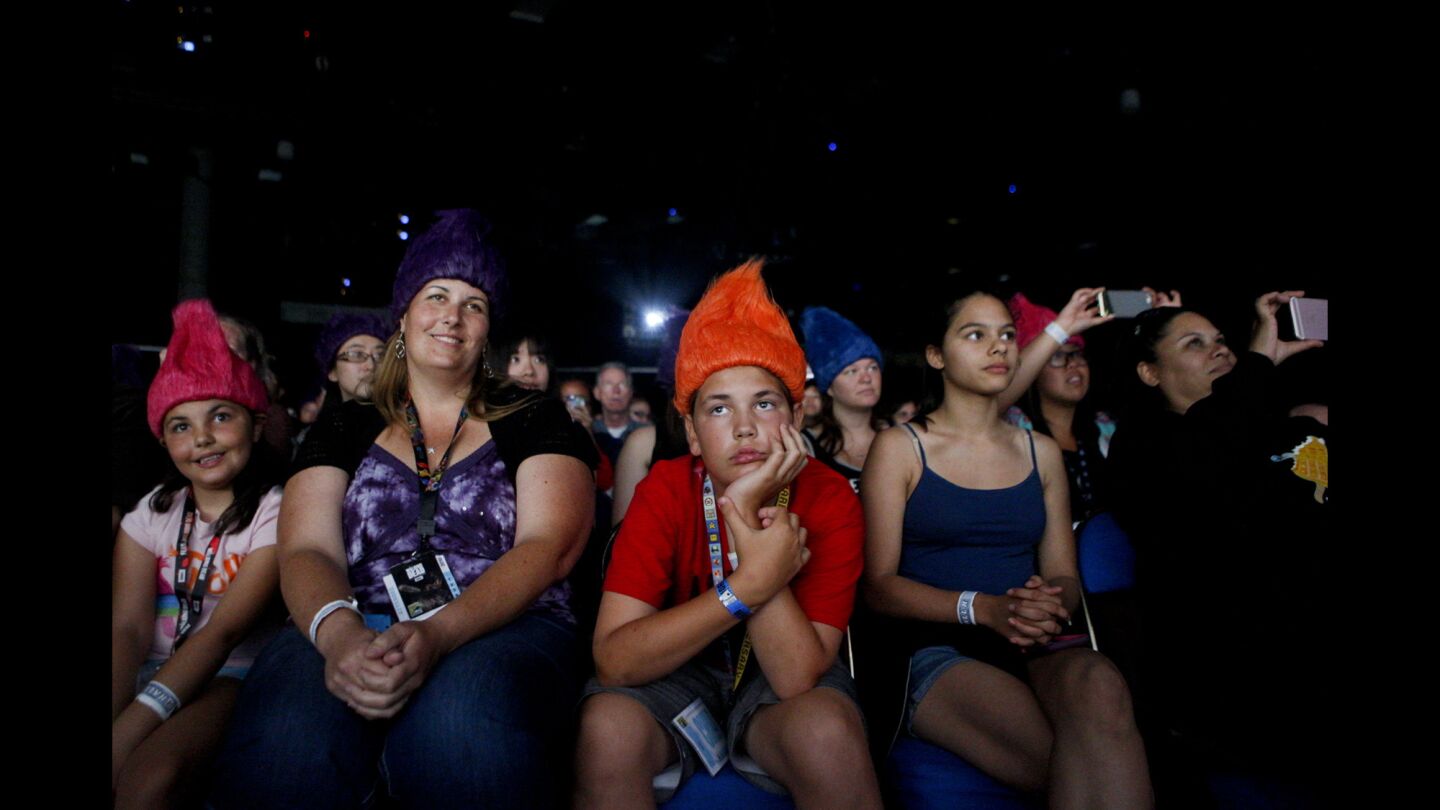 Audience members listen as Justin Timberlake, Anna Kendrick and other stars answer questions during a panel discussion for the movie "Trolls," during the first day of the Comic-Con International convention at the San Diego Convention Center.