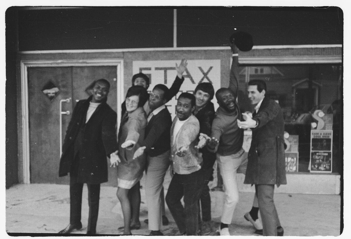Musicians pose outside Stax Records. 