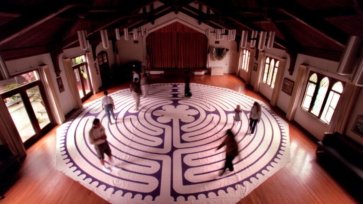 The faithful pray and meditate while walking a labyrinth on Good Friday in 2000 at Neighborhood Congregational Church in Laguna Beach.