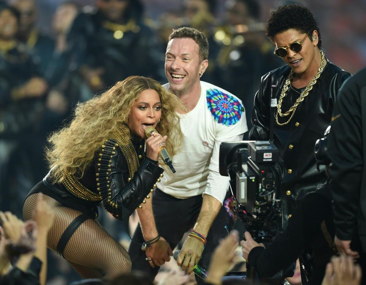 Beyonce, Chris Martin and Bruno Mars perform during Super Bowl 50 between the Carolina Panthers and the Denver Broncos at Levi's Stadium in Santa Clara, California, on February 7, 2016. TIMOTHY A. CLARY/AFP/Getty Images