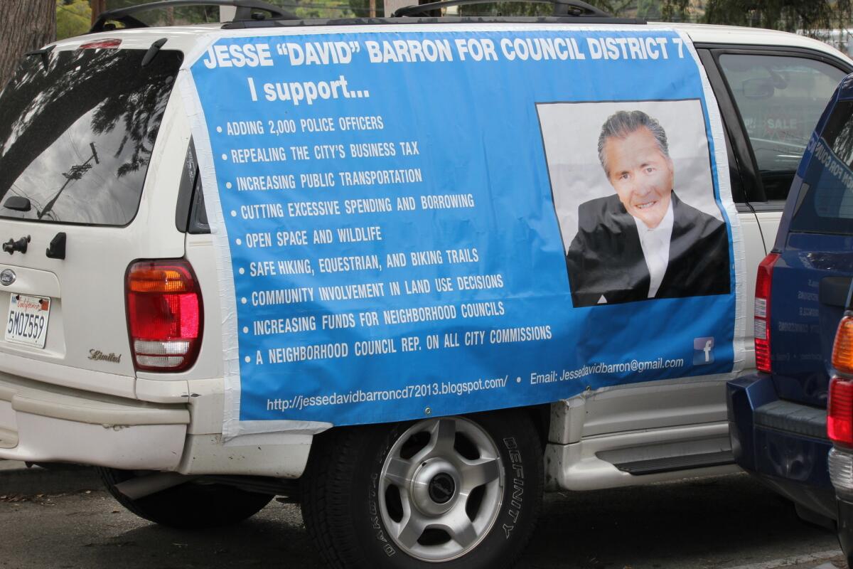 Jesse David Barron displays his campaign platform on his van.