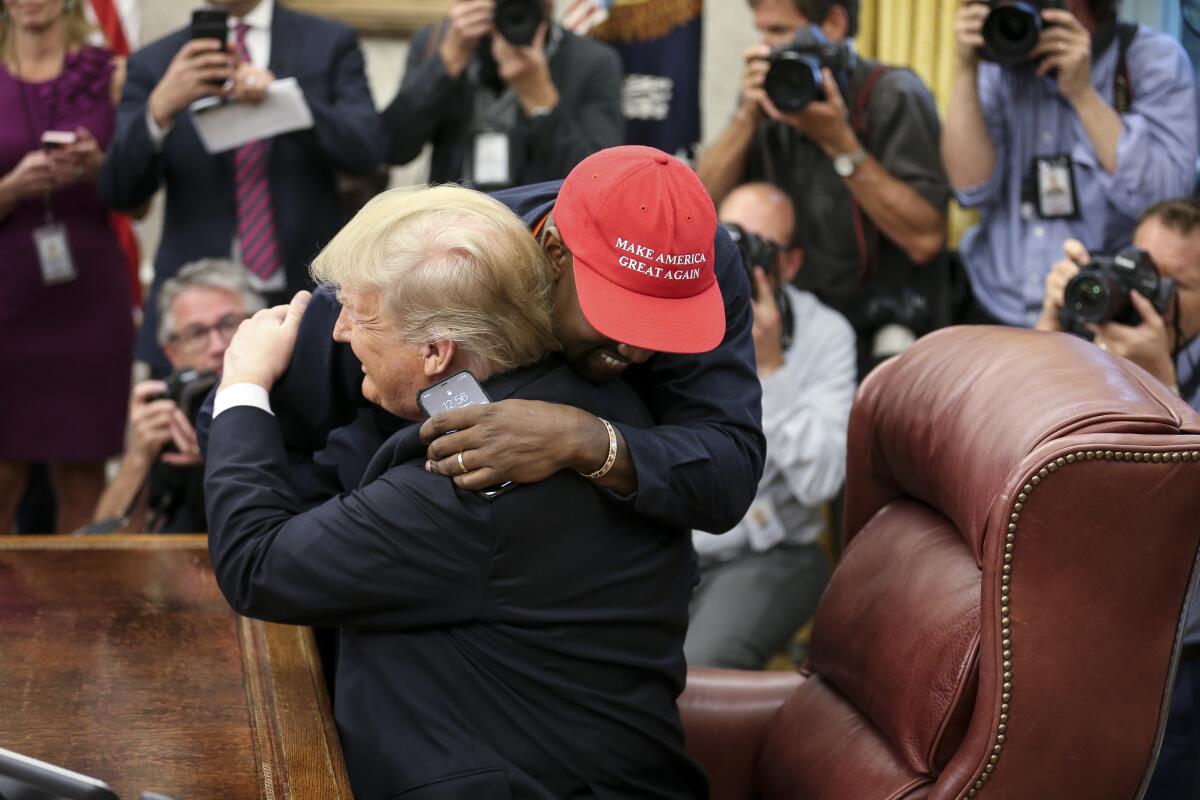 Kanye West hugs Donald Trump