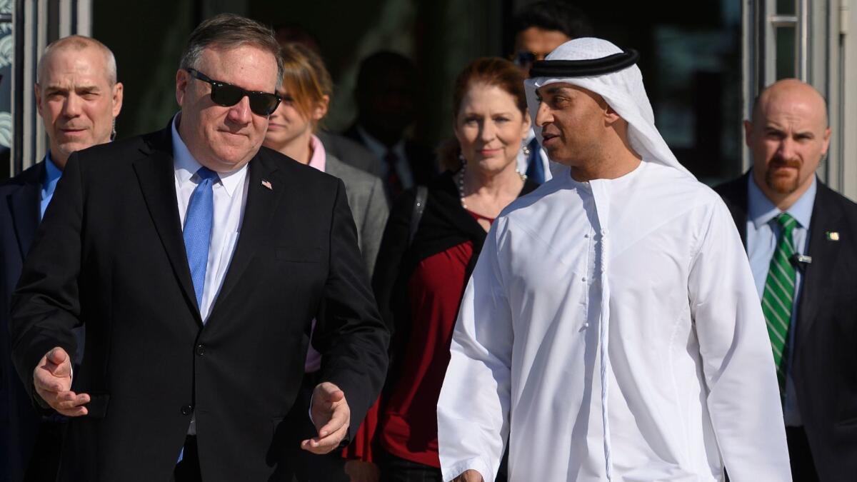 Secretary of State Michael R. Pompeo, left, speaks with Emirati Ambassador to the U.S. Yousef Otaiba in Abu Dhabi on Jan. 13, 2019.
